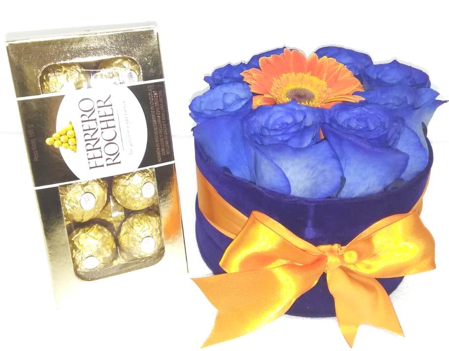 Caja Redonda 8 Rosas Azules y 1 Gerbera con Bombones Ferrero Rocher 100 gramos